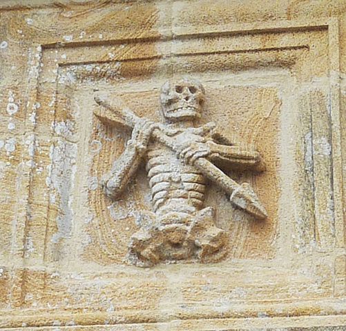 Ankou, depicted on a carving at the ossuary of the chapel of St Joseph at Ploudiry, Brittany.