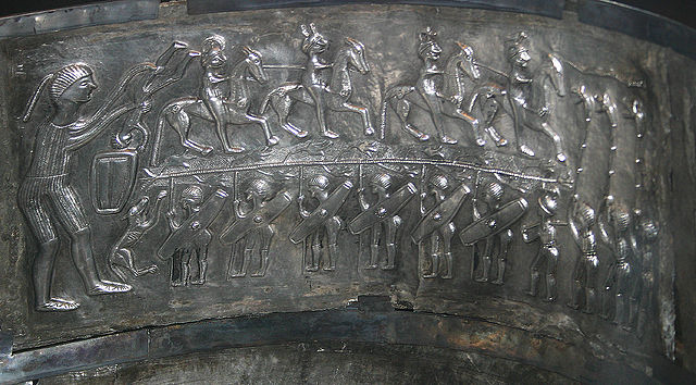 The 'warrior' panel from the interior of the cauldron. Note the branch between the warriors - the flowers look like Henbane. Photo: Malene Thyssen