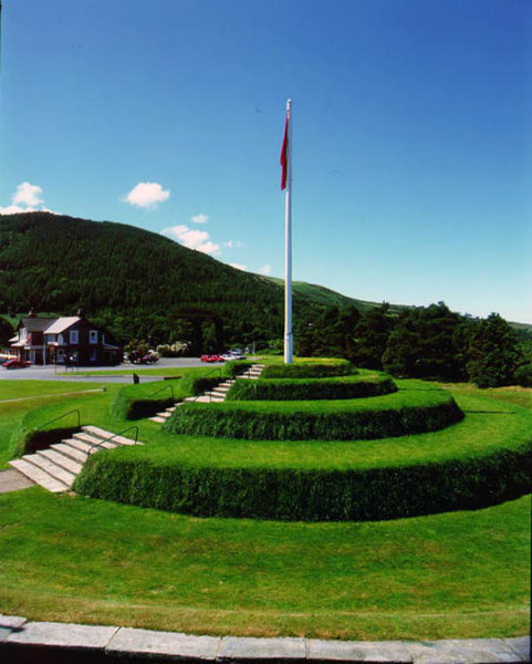 The Tynwald Hill in St John's, Isle of Man. Slieu Whallian is the mountain in the background - it is the terminal peak on the ridge descending from South Barrule, which is cited in Manx legend as home of the god Manannan.
