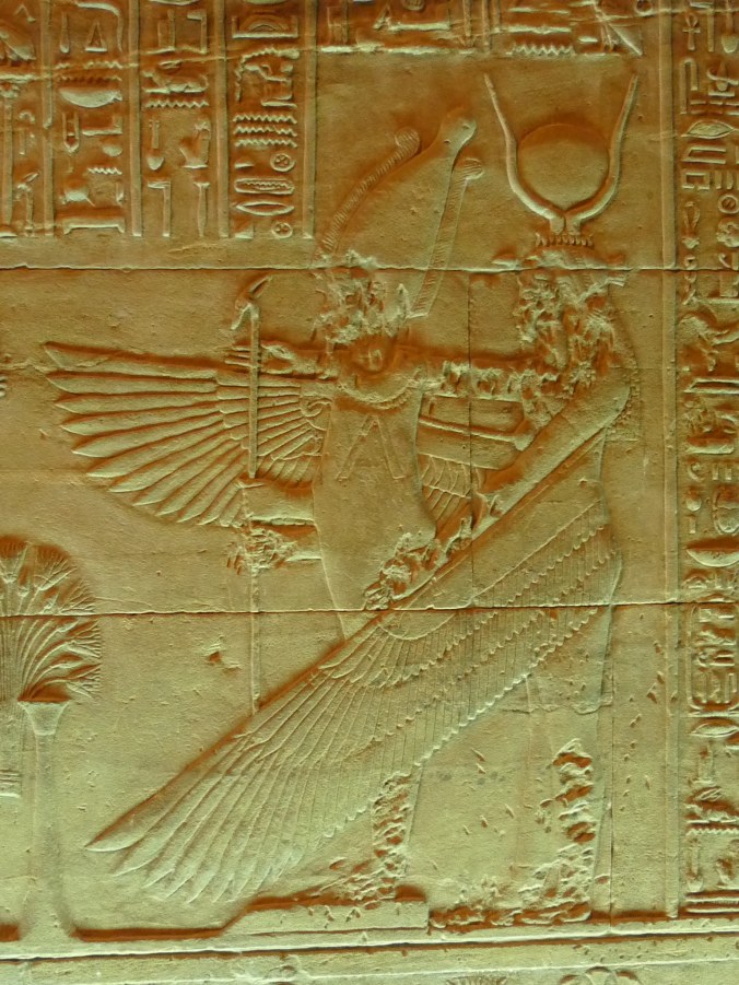 Bas relief image from Philae showing Isis resurrecting and embracing Osiris. Note the historic damage caused by Islamic iconoclasts.