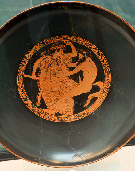 The wide shallow drinking Kylix offered the perfect mirror-surface. The Dionysian imagery in this example shows a female and male devotee of the Dionysian mysteries: a maenad and a satyr.