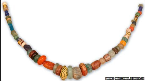 Holed stones and a necklace of glass beads and stones were among the grave goods of a pagan viking burial at Peel Castle in the Isle of Man. 