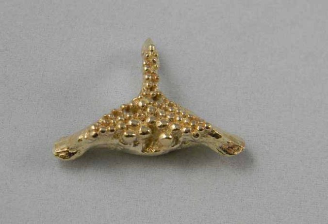 Contemporary gold casting of 'Crosh Bollan' amulet from the Isle of Man (courtesy of Celtic Gold). It is cast from the palatal bone of the Bollan Wrasse, which bears a striking similarity to 'Thor's Hammer' and the 'Slavic Axe'. 